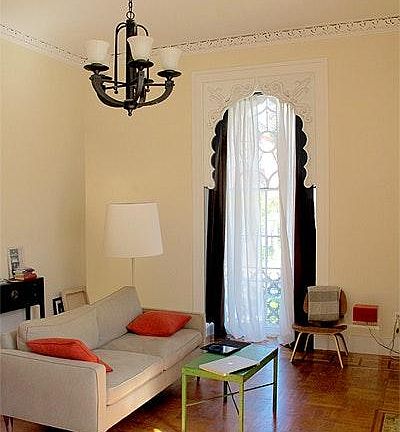 large living/eating area with floor to ceiling windows