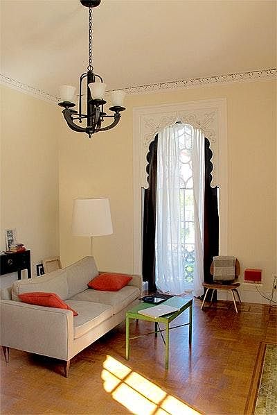 large living/eating area with floor to ceiling windows