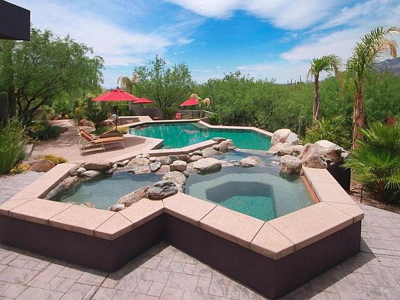 saltwater pool with waterfall and spa