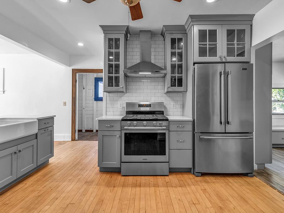 kitchen with subway tile backsplash and new stainless steel appliances