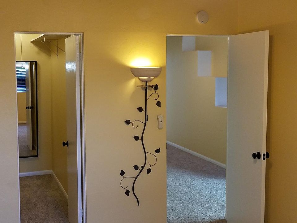 Bedroom facing walk-in closet and living room