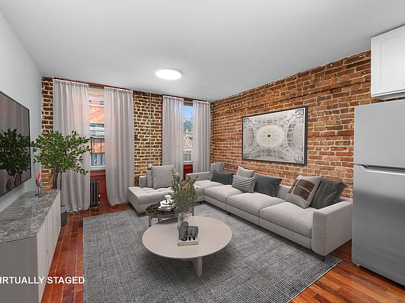 2nd image of 150 E 3rd St APT 2E