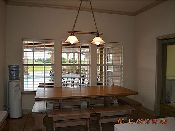 No formalness here, just family friendly eat in kitchen area overlooking the pool!