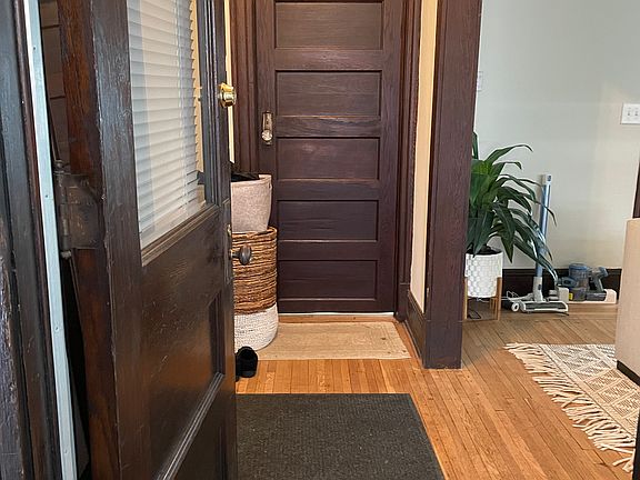 Entrance into apartment with coat closet ahead