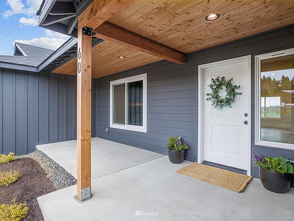 Excellent lighting, beautiful T&G ceiling and wide poured cement porch make this entrance extra welcoming.