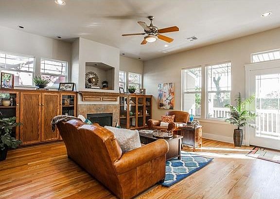 It's the perfect season to enjoy a fire in the slate trimmed gas fireplace. The built-in cabinets on either side include custom lighting and can be adjusted for books, collectibles, or your entertainment system.