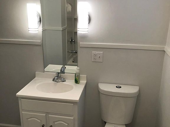 New sink & cabinet, new vanity mirror, new toilet, new floor