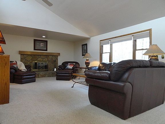 This very comfortable living room has a gorgeous cozy stone wood burning fireplace!