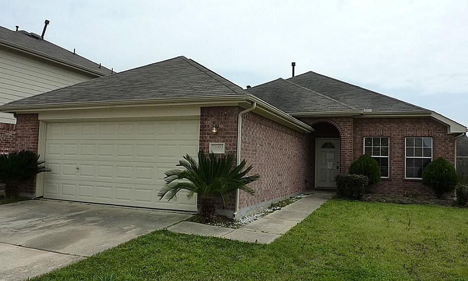 Front of this one story, 4 bedroom, 2 bathroom home