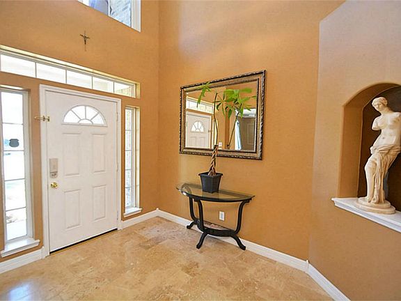 As you enter you are greeted with a 2 story foyer that exudes elegance