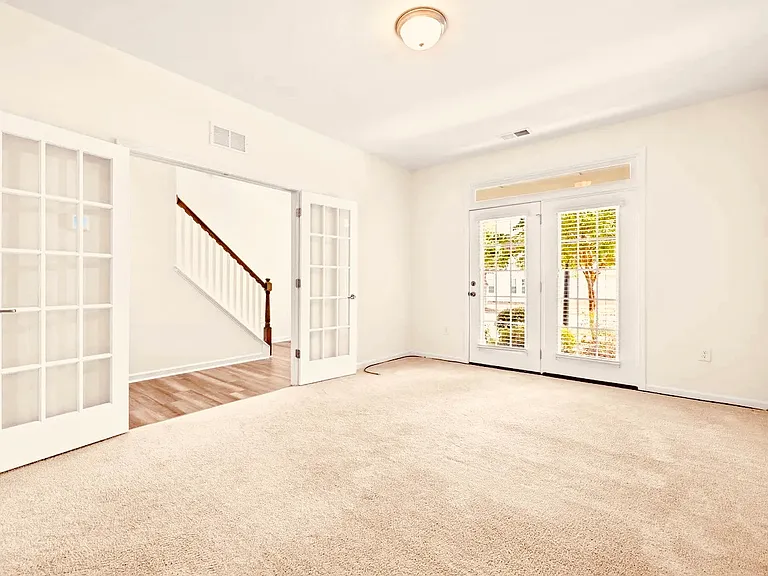 4th Bedroom. Can serve as bonus room, study or office. French doors to hallway, extra closet space and full bathroom, with another set of French doors leading to front porch.