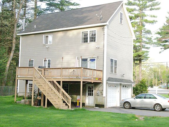 Large Deck, professionally landscaped yard with automatic sprinkler system