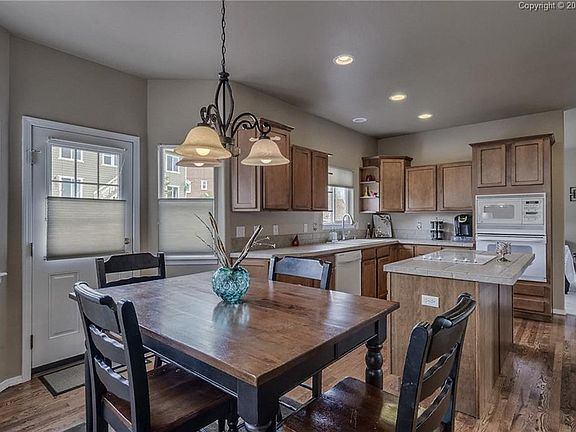 The spacious kitchen with eat-in area has a walk-out to the large deck!