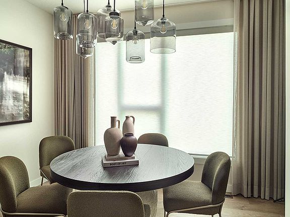 A photo of the dining are in the Alameda show home in Crown Park by Brookfield Residential