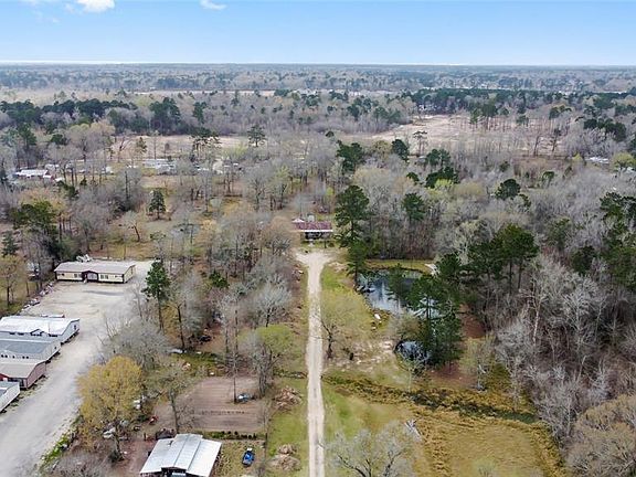 Aerial view looking South. Home and pond pictured! 6 acres.