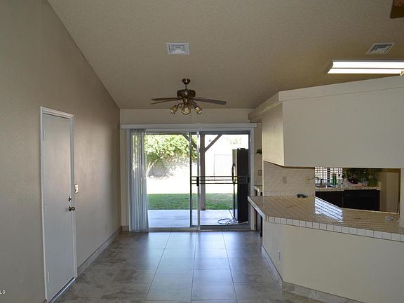 Tiled floors in living, dining and kitchen.