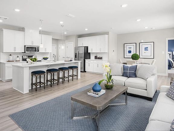 Model Stratton living area and kitchen overview (courtesy of NVHomes)
