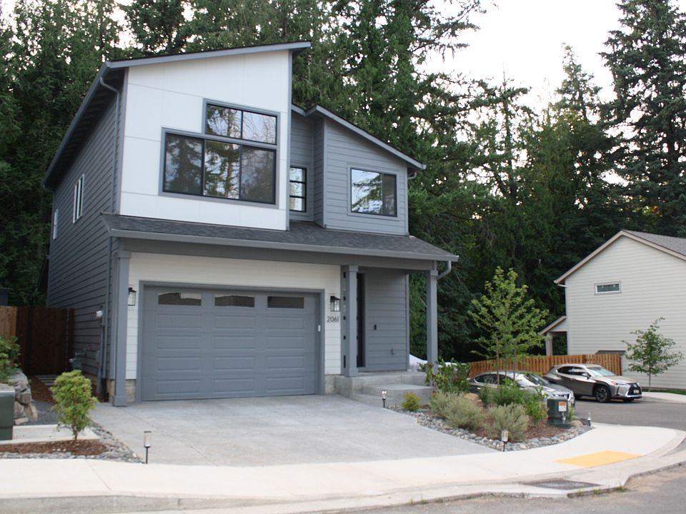This charming property features a spacious two-car garage with a smooth concrete driveway, providing easy access and ample room for multiple vehicles. Additional street parking is available.