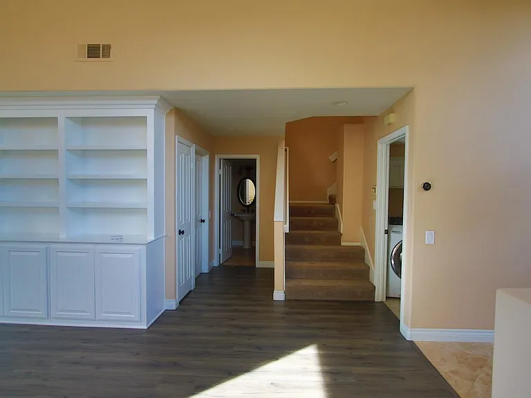 Stairs and hallway to bathroom, kitchen and laundry room