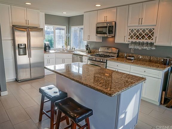 The closed-off kitchen was remodeled with the wall