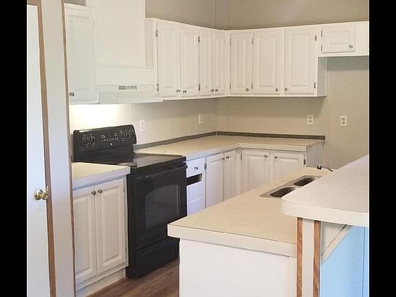 Light and airy Kitchen with Raised breakfast bar leading out to your covered deck overlooking your private backyard