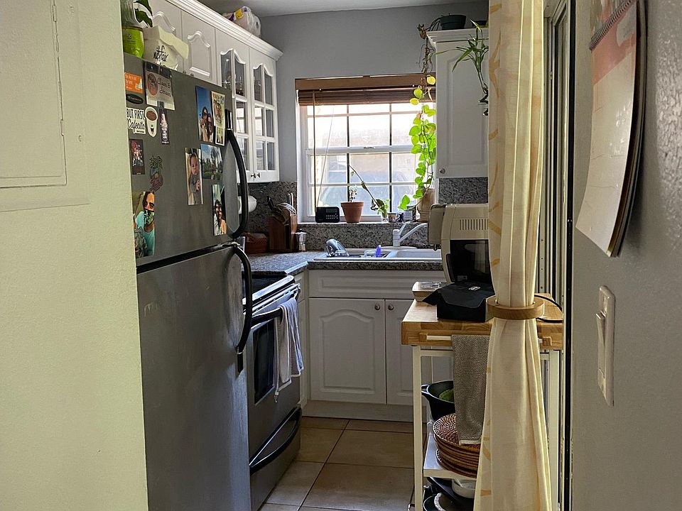 Cozy kitchen with oven range, microwave and fridge (no dishwasher)
