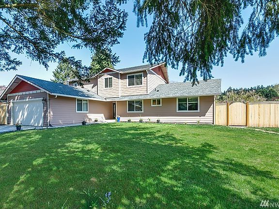 Huge corner lot and gate entrances on both sides of home. 