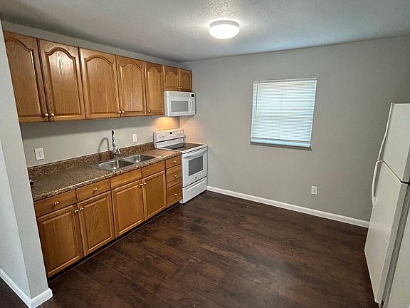Kitchen: glass top stove, microwave hood, refrigerator w/ice maker, double stainless sink