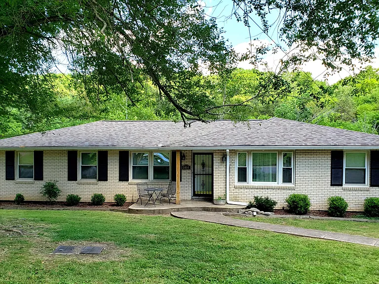 Brick duplex: 3 bedrooms, 2.5 baths, living room, eat-in kitchen, recreation room and 2 bonus rooms and mudroom area in walkout basement plus attached garage and exterior parking area.