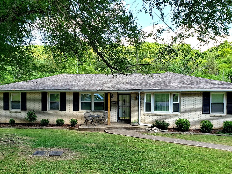 Brick duplex: 3 bedrooms, 1 full bath + 2 half baths, walkout basement with family room, 2 bonus rooms, and a garage.
