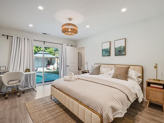 Master Bedroom with King Bed, desk, and ensuite bathroom