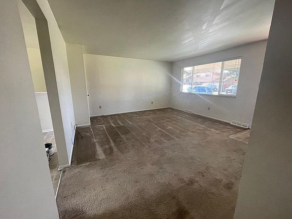 Living room. Front walk and drive way are south facing- snow melts quickly.