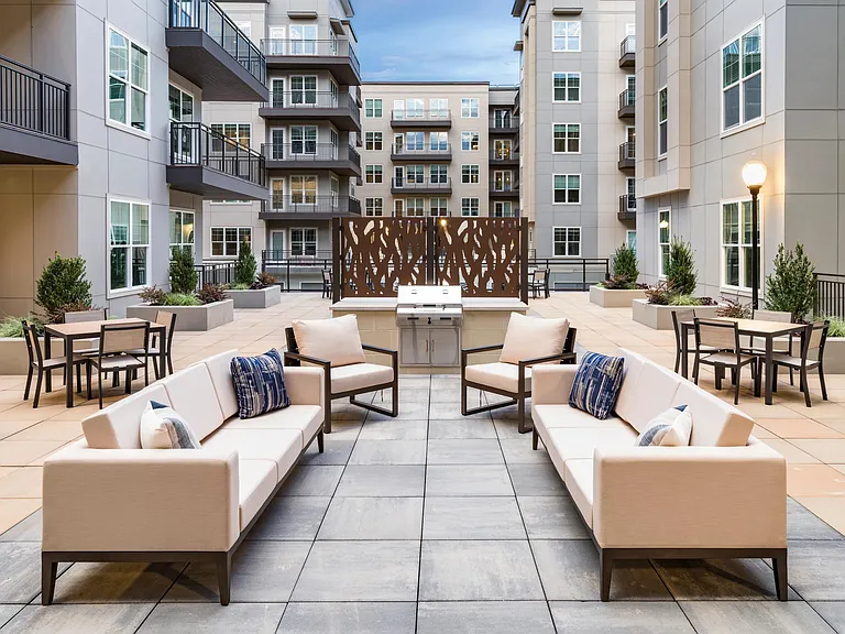 Enjoy open-air gatherings at Modera Liberty Row with stylish courtyard seating and grilling stations, just steps from Uptown Charlotte.