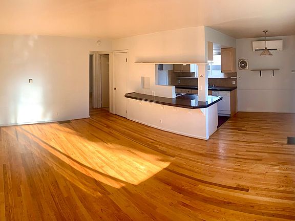 Expansive great room with newly refinished hardwoods.