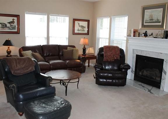 Large Family room with gas fireplace - shown with furniture