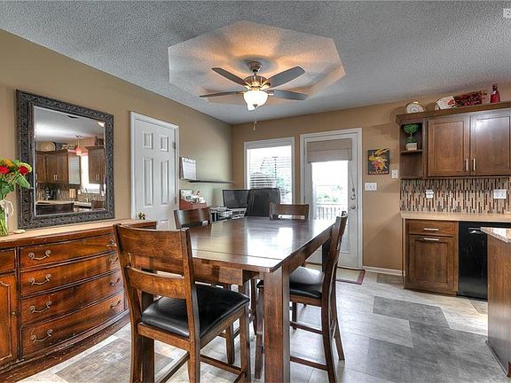 Dining room area, new ceiling fan, new floors
