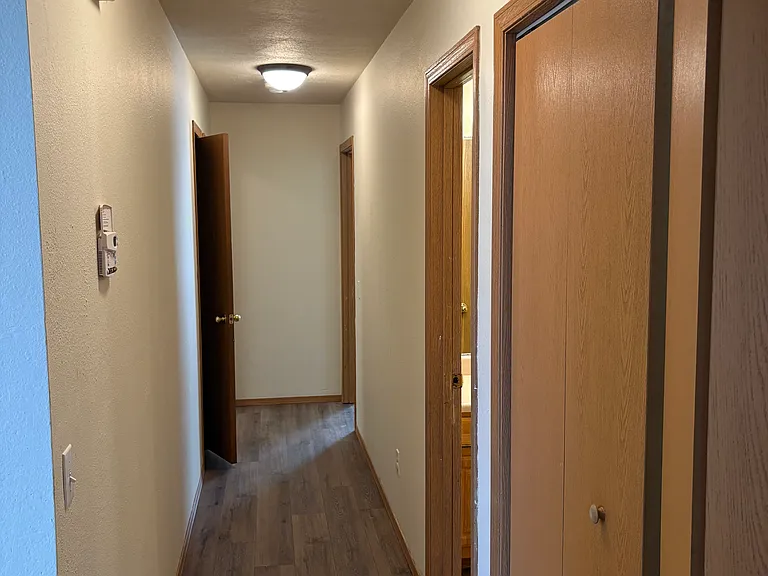 Hallway right side -laundry closet, guest bathroom, master bedroom top right, left side, hall closet well lit with double led lights