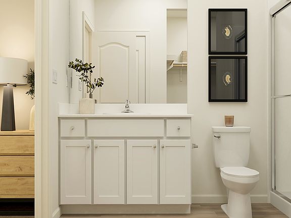 Inside the en-suite master bathroom, you ll find a step in shower and a large vanity!