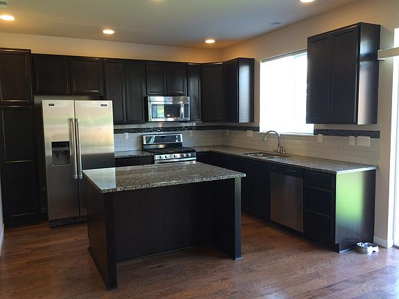 Kitchen with Stainless Steel and Granit Counters