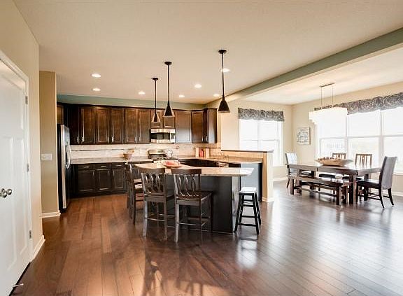 Very spacious kitchen provides tons of counter and cabinet space as well as ugraded kitchen appliances. Notice all of the natural lighting from the abundance of windows.