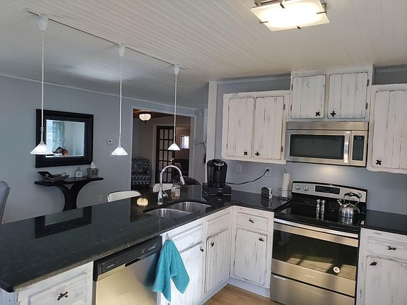 Fabulous Kitchen with Custom cabinets, granite, and hardwood floors.