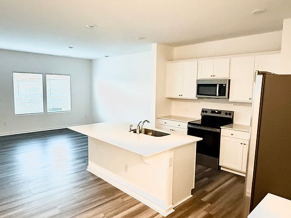 Spacious kitchen with sink island.