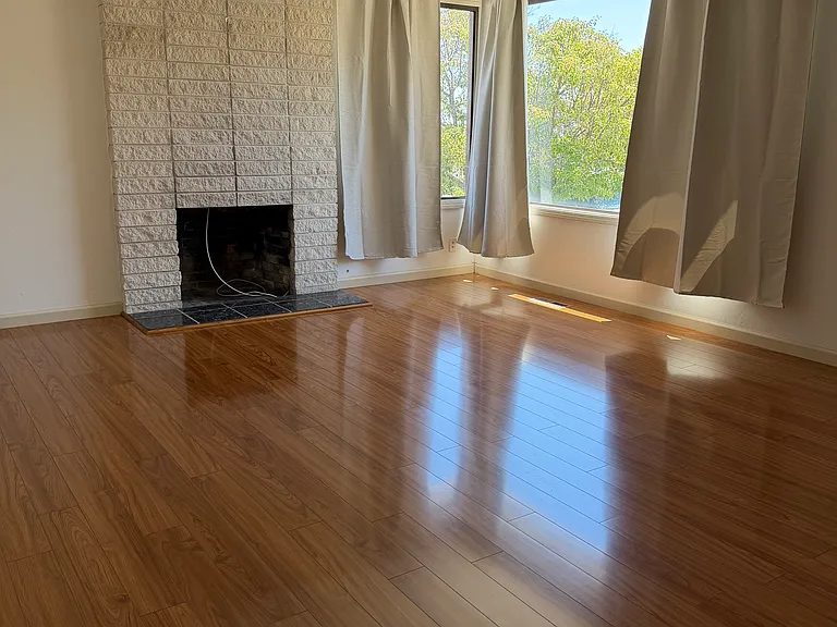large bright living room upon entry (with attached dining room)