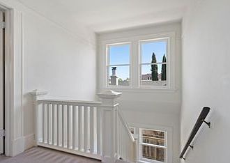 Light filled stairwell up to Unit B which is the top floor of this Queen Anne Victorian Up/Down Duplex.