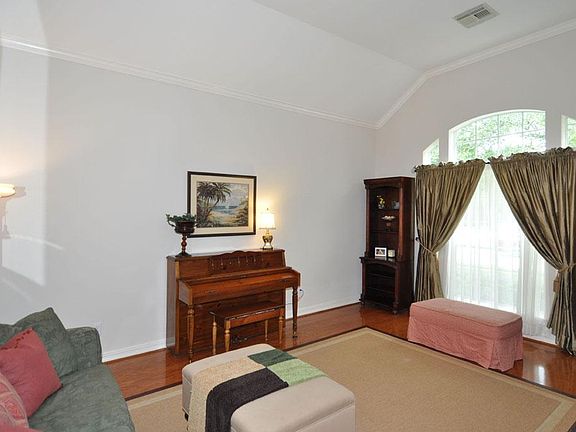 Wood floors adorn the living, dining, entry, family rooms, and the hallways.