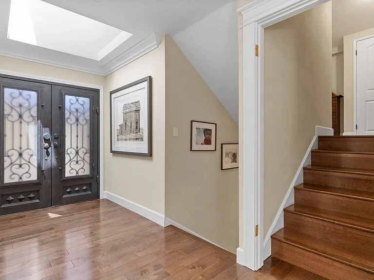 Upstairs leads to the bedroom and office