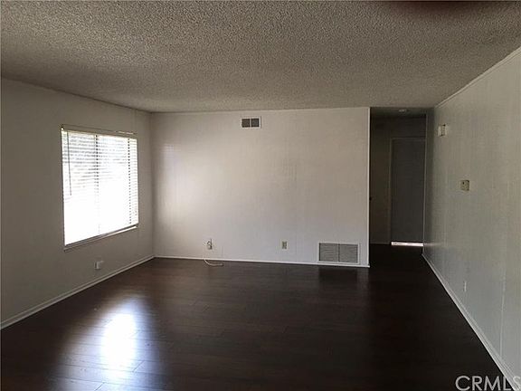 LARGE FAMILY ROOM OFF KITCHEN. NEW LAMINATE FLOORING