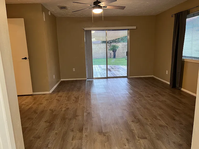 Master bedroom with sliding door connects to the outdoor deck and the beautiful landscape.