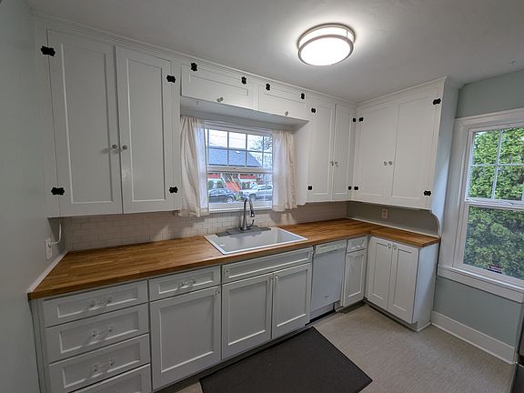 Remodeled kitchen with butcher block counters and deep sink