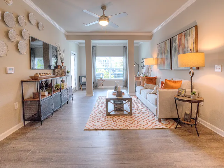 Spacious living room with wood-designed flooring
